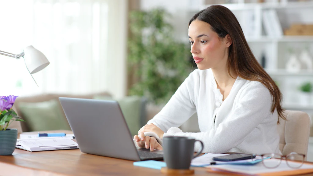 Self employed working online using personal computer at home